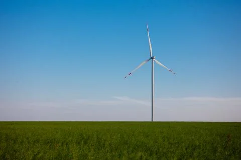 Panoramic view of wind farm or wind park, with high wind turbines for generat Stock Photos