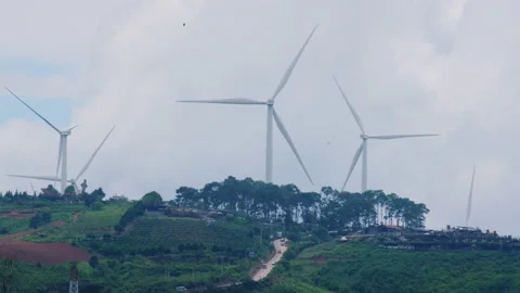 Panoramic view of wind turbines with beautiful landscapes and blue sky. Видео 204971786
