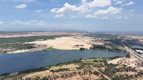 Panoramic view of wind turbines desert and lake at Phan Thiet Stock Footage 315328159