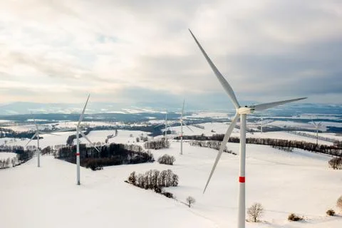 Panoramic view of wind turbines or windmills for production of a clean and Stock Photos