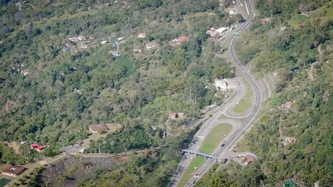 Panoramic View of Winding Mountain Road and Scenic Hillside Homes Stock Footage 316794235