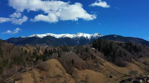 Panoramic view of the winter rural landscape with snowy mountains in the back Video stock 104490771