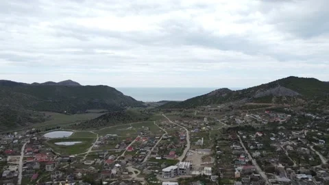 Panoramic views of the small town standing in the mountainous terrain Video stock 159670707