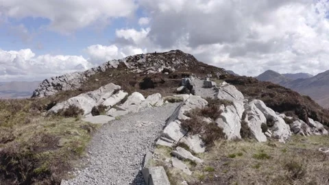Panoramic Walking along stone path in irish mountain in a sunny day with clouds 動画素材 206032182