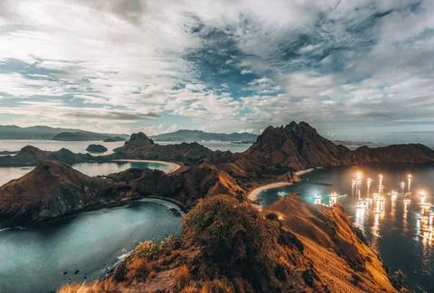 Panoramic warm view at top of Padar Island in sunrise late morning from Komodo Stock Photos