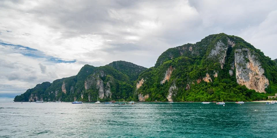 Panoramic wide-angle view of Ko Phi Phi island in Thailand from the sea, su.. Stock Photos
