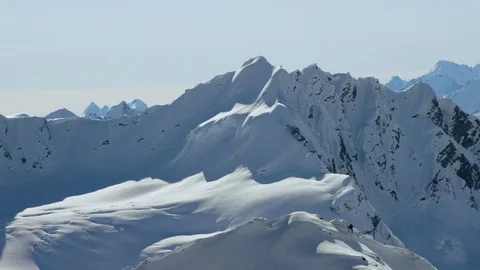 Panoramic wide shot of snow covered mountains Stock Footage 113261999