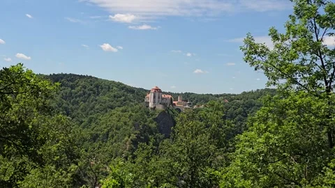 Panoramic Wide Shot Of Vranov Castle Above Dense Forest, time lapse Stock Footage 344396473