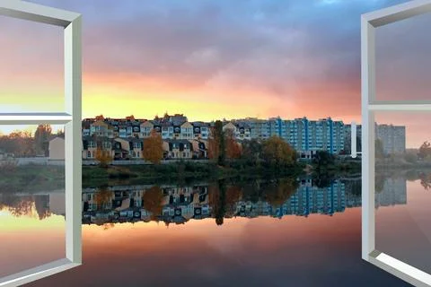 Panoramic window with view of red sunset above city buildings. Evening city.. Stock Photos