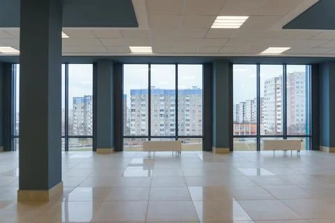 Panoramic windows in an empty spacious room. Installation of fiberglass windo Stock Photos
