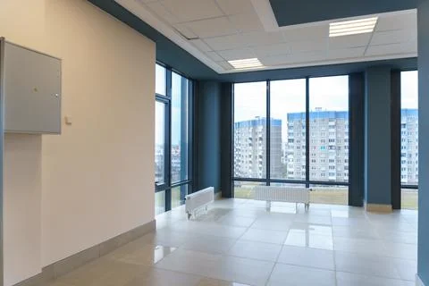 Panoramic windows in an empty spacious room. Installation of fiberglass windo Stock Photos