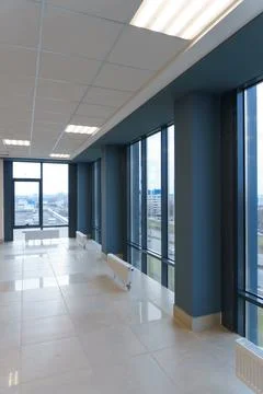Panoramic windows in an empty spacious room. Installation of fiberglass windo Stock Photos