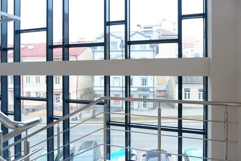 Panoramic windows in an empty spacious room. Installation of fiberglass windo Stock Photos