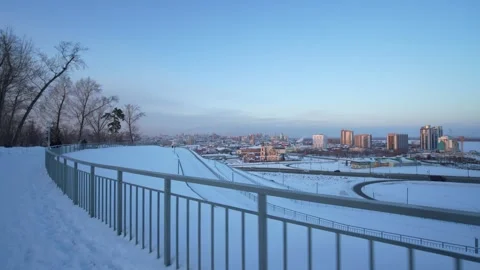 Panoramic winter cityscape viewed from a hill Stock Footage 328460371