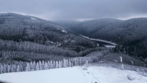 Panoramic winter drone view of the mountains in the forest. Stock Footage 232411639