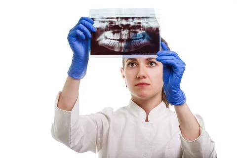 Panoramic x-ray image of teeth in hands of dentist. The doctor - dentist wome Stock Photos