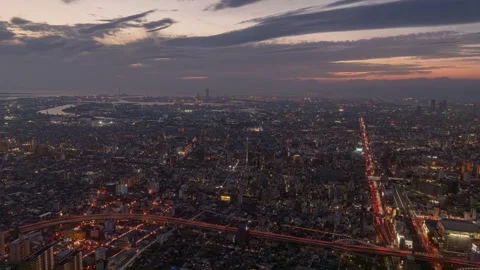 PanRight Sunset Timelapse of Osaka Cityscape Transitioning from Day to Night Stock Footage 326296486