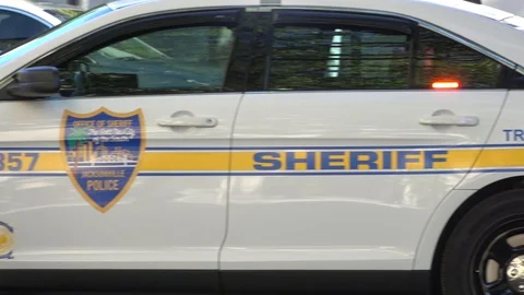 Pans of sheriff car 4 Stock Footage 128446731