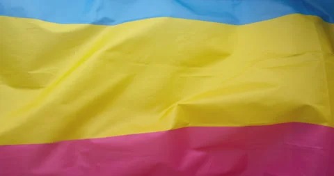 The pansexuals flag flutters in the wind. Close-up. HQ Stock Footage 169432045