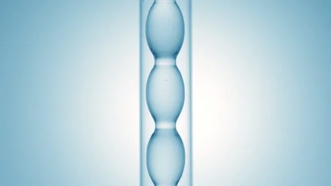 Panthenol solution filling and draining in bulb condenser lab Stock Footage 337106924