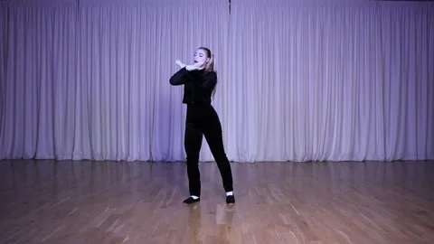 A pantomime actress imitates a bird with her hands on stage. Stock Footage 310057743