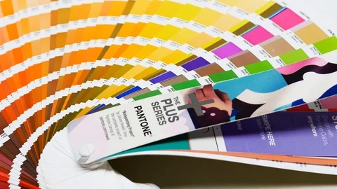 PANTONE spot color swatches in DTP studio, glide with pantone label, prepress an Stock Footage