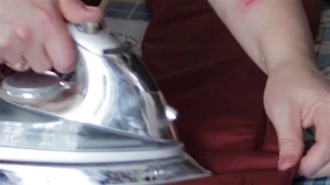 Pants ironed with iron Stock Footage 76768697