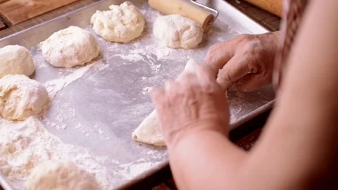 Panzerotti and calzone folding process homemade by senior chef Stock-Footage 149283425