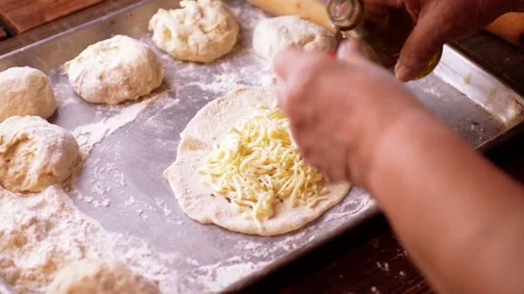 Panzerotti Italian cuisine making of adding oil ingredient by senior chef Stock-Footage 149283473