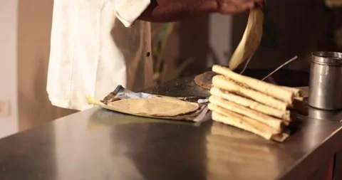 Papad roasting on chulla oven charcole making food indian Stock Footage 224603290