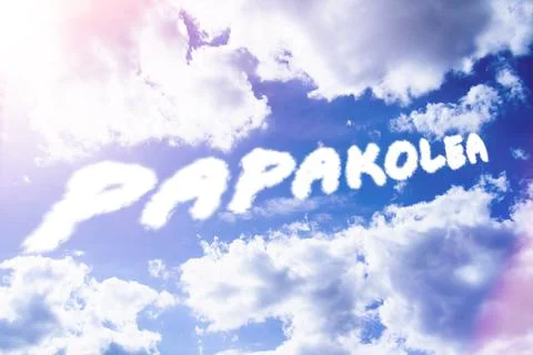 Papakolea. Text from clouds in sky in bright sunlight. Stock Photos