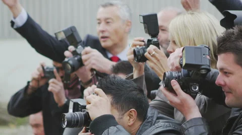 Paparazzi crowd fighting to get the best picture Stock Footage 40103930