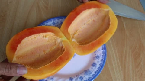 Papaya and knife Stock Footage 58625793