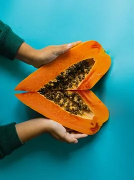 Papaya on a blue background Stock Photos