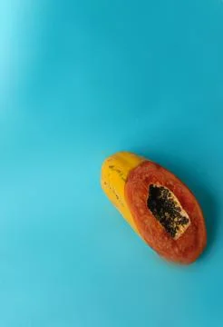 Papaya on a blue background Stock Photos
