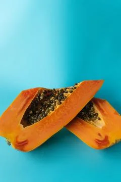 Papaya on a blue background Stock Photos