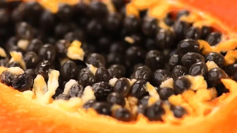 Papaya fruit pulp with seeds, macro background. Halved fresh organic Papaya Stock Footage 334820178