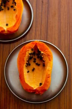 Papaya in a plate on the table Stock Photos