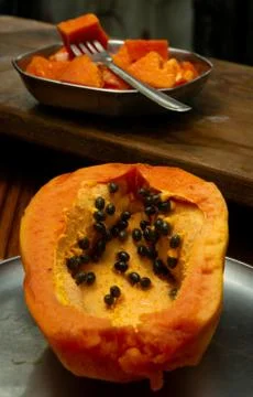 Papaya in a plate on the table Stock Photos