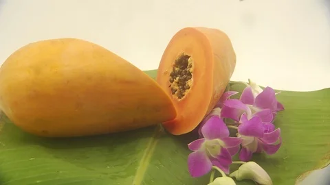Papaya on white background rotating with blender and papaya smoothie Stock Footage 118772921