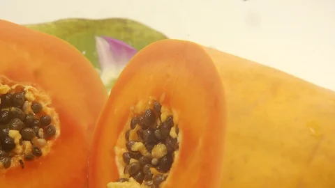 Papaya on white background rotating with blender and papaya smoothie Stock Footage 118772939