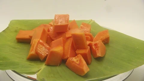 Papaya on white background rotating with blender and papaya smoothie Stock Footage 118773333
