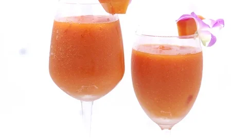 Papaya on white background rotating with blender and papaya smoothie Stock Footage 118773545