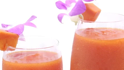 Papaya on white background rotating with blender and papaya smoothie Stock Footage 118773605