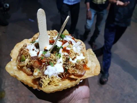 Papdi chaat indian spice hand held salty and sweet Stock Photos