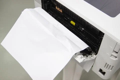Paper A4 Stuck In Printer At Office, concept repair printer 库存照片