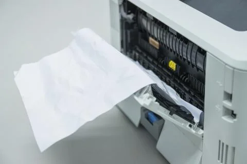 Paper A4 Stuck In Printer At Office, concept repair printer 库存照片