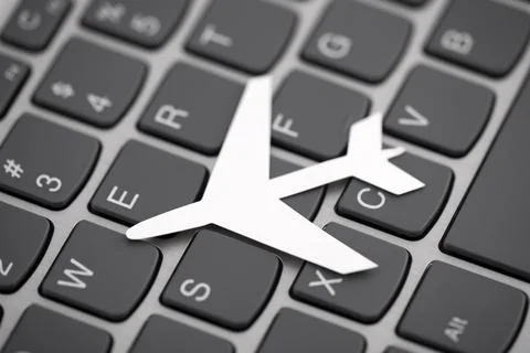 Paper airplane shape on computer keyboard Stock Photos
