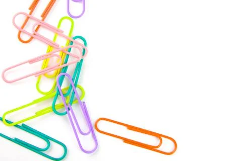 Paper and multi-colored paper clips Stock Photos