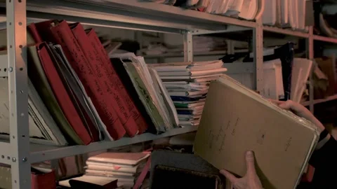 Paper archive shelf. Hands taking old files, folders, documents, music lead fake Video stock 230218808